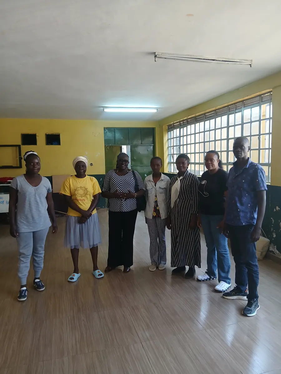 Caregivers standing together after a capacity-building training session